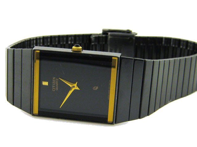 Citizen Ladies Watch: This is a Citizen Ladies Watch with the following features: Stainless steel; black dial; gold tone hands; black ion plated bezel with gold tone; black ion plated stainless steel bracelet with Safety F