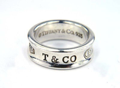 Tiffany & Co Silver Ring: Tiffany & Co Silver Ring.The total rings weight is 7.1 grams. The size of ring: 6. The ring is 12 mm wide and 3 mm in thickness.