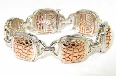 Charles Krypell 14K Gold / Silver Bracelet: Charles Krypell 14K Rose Gold / Silver Bracelet Weight of Bracelet: 56.5 grams.The length of Bracelet: 7".The bracelet is 18 mm wide and 6 mm in thickness.