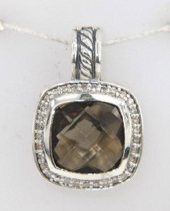 David Yurman Silver Smoky Topaz & Diamond Pandent: David Yurman Silver Smoky Topaz with Diamond Pendant. The total Pandent's weight is 6.4 grams. Pandent size is 23 x 16 mm, 9 mm thick. The size of Smoky Topaz is 11 x 12 mm. The total diamond weight i