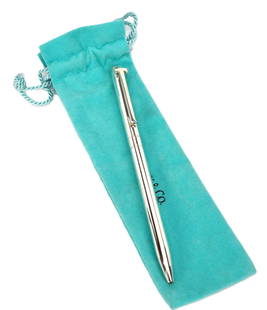 Tiffany and Co. T Clip Sterling Silver Retractable Ball Point Pen: Tiffany and Co. T Clip Sterling Silver Retractable Ball Point Pen. Tiffany & Co. T Clip retractable ball point pen in original pouch. Pen is 5.25"" long. Shows very minor use. Tiffany cartridge with b