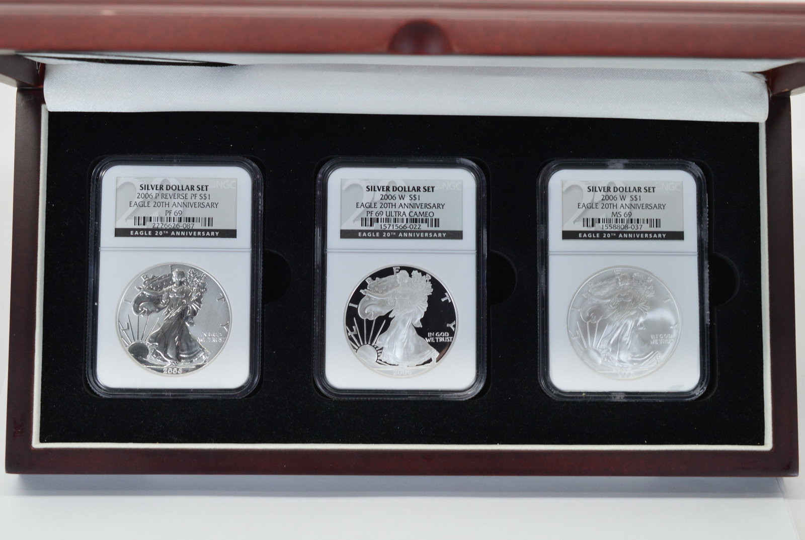 2006 American Eagle Silver Dollar Three Certified Coin Anniversary Set NGC MS69: American Eagle Silver Dollar Three Certified Coin Boxed Set / 2006 20th Anniversary Set NGC Certified MS69 in Deluxe Wood Presentation Box. Includes: 2006 P Reverse PF 69, 2006 W PF69 Ultra Cameo and