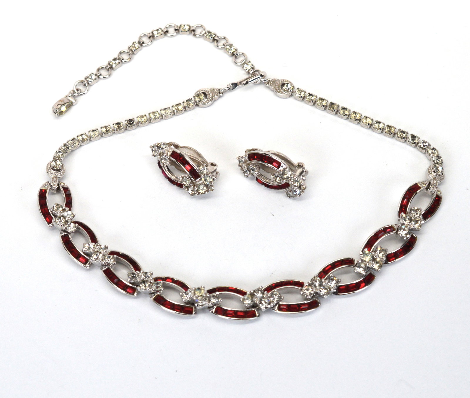 Vintage Pennino Rhinestone Necklace & Matching Clip Earrings Set: Vintage Pennino Brothers Deep Red & Sparkling Rhinestone Choker & Matching Earrings. Pennino is a highly collectible brand of vintage American costume jewelry, known for its elegant floral and ribbon