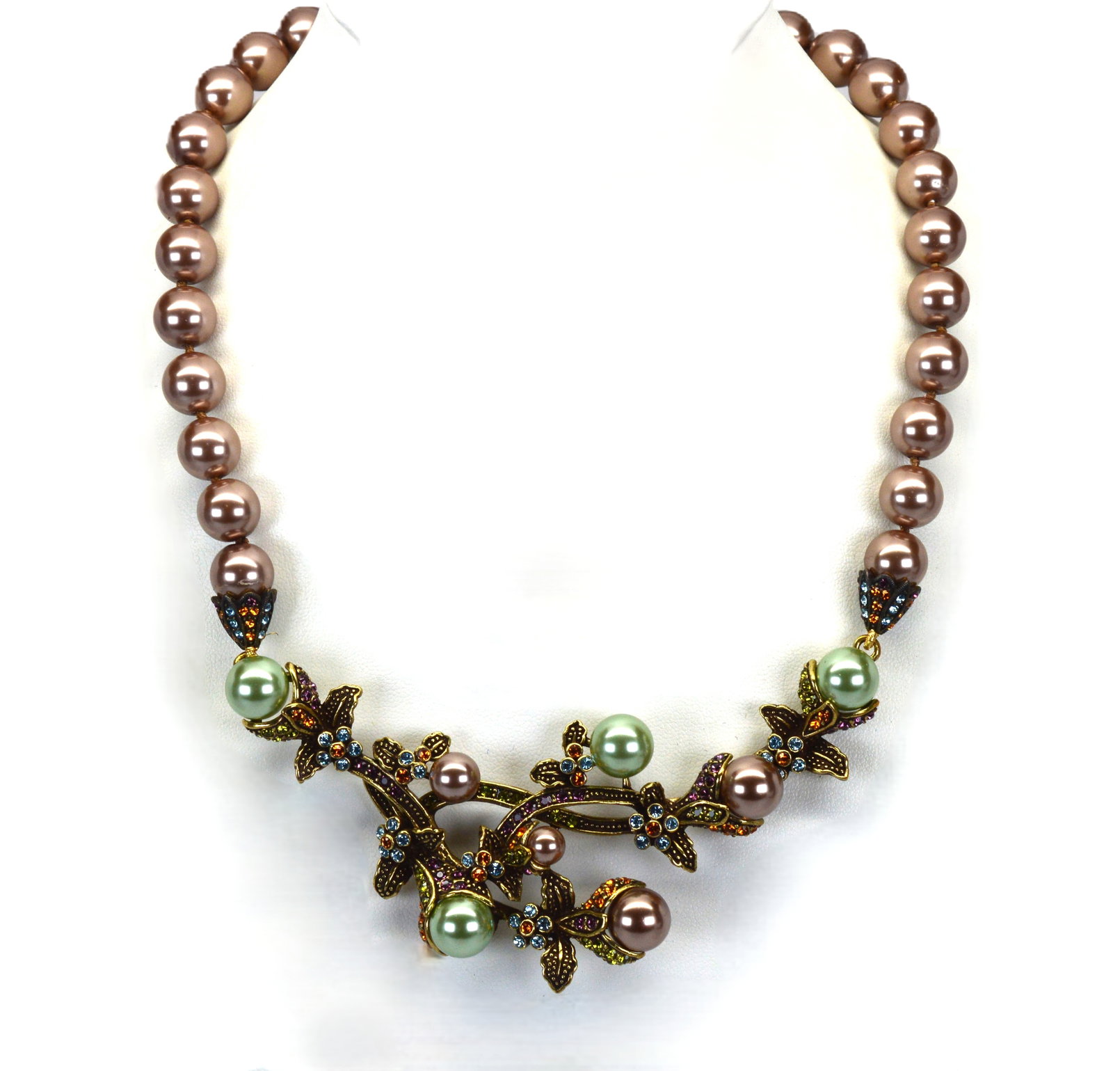 Heidi Daus Vine & Divine Beaded Crystal Drop Necklace NIB: Heidi Daus Vine & Divine Beaded Crystal Drop Necklace is 16" long with a 4" extender. It has 10MM deep taupe beads. The statement piece is 4" wide and 1.75" long with multi-color crystals. New in box.