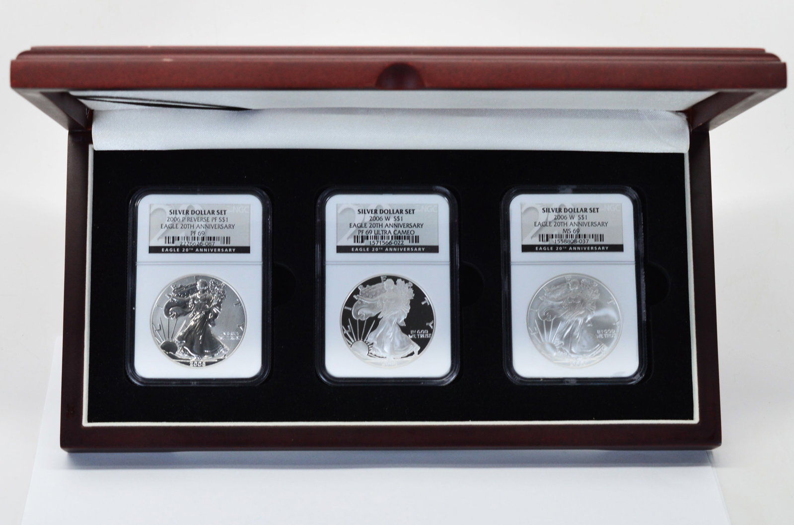 2006 American Eagle Silver Dollar Three Certified Coin Anniversary Set NGC MS69: American Eagle Silver Dollar Three Certified Coin Boxed Set / 2006 20th Anniversary Set NGC Certified MS69 in Deluxe Wood Presentation Box. Includes: 2006 P Reverse PF 69, 2006 W PF69 Ultra Cameo and 