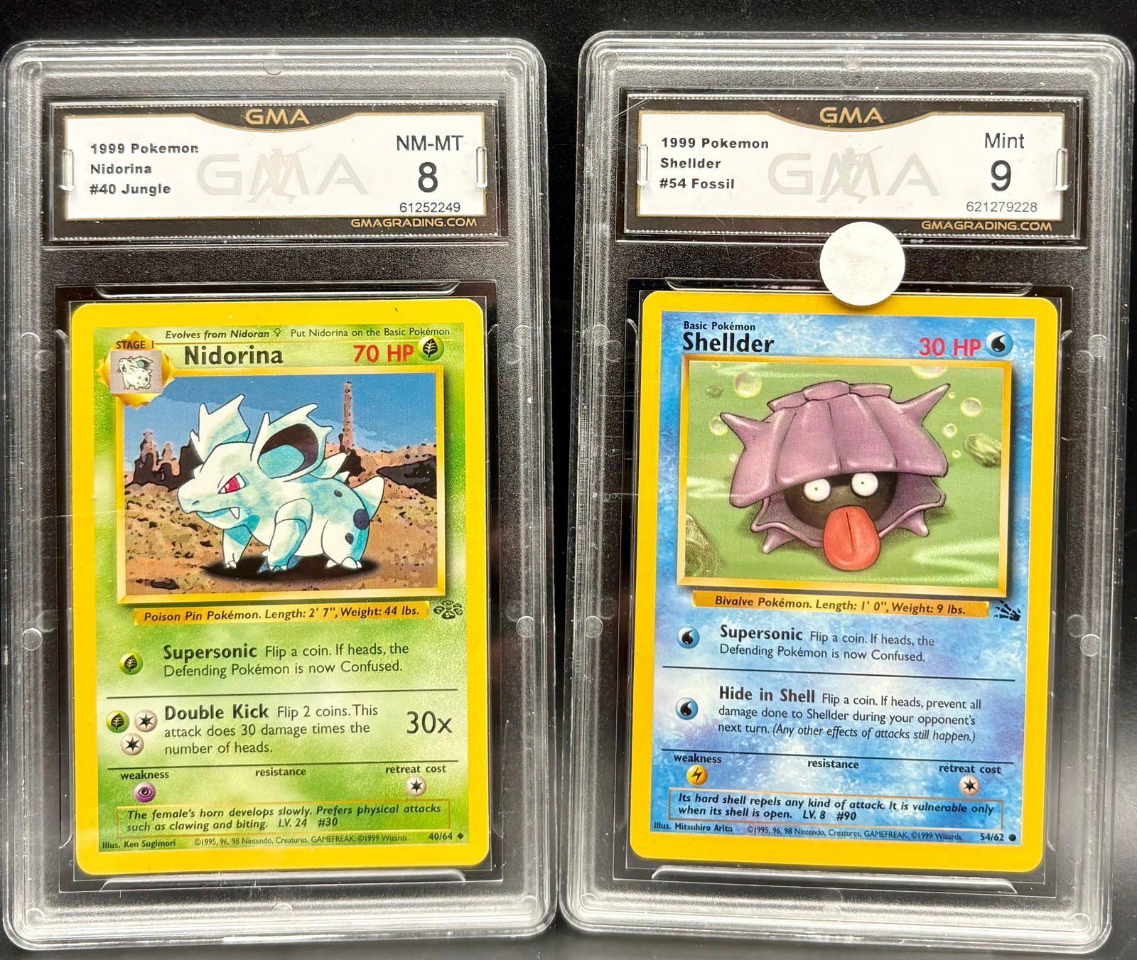 1999 Pokémon Nidorina #40 Jungle GMA 8 + Shellder #54 Fossil GMA 9 – Vintage Lot: 1999 Pokémon Nidorina #40 Jungle GMA 8 + Shellder #54 Fossil GMA 9 – Vintage LotThis vintage Pokémon card lot includes two graded classics:Nidorina (#40 Jungle, GMA NM-MT 8), with vivid color and