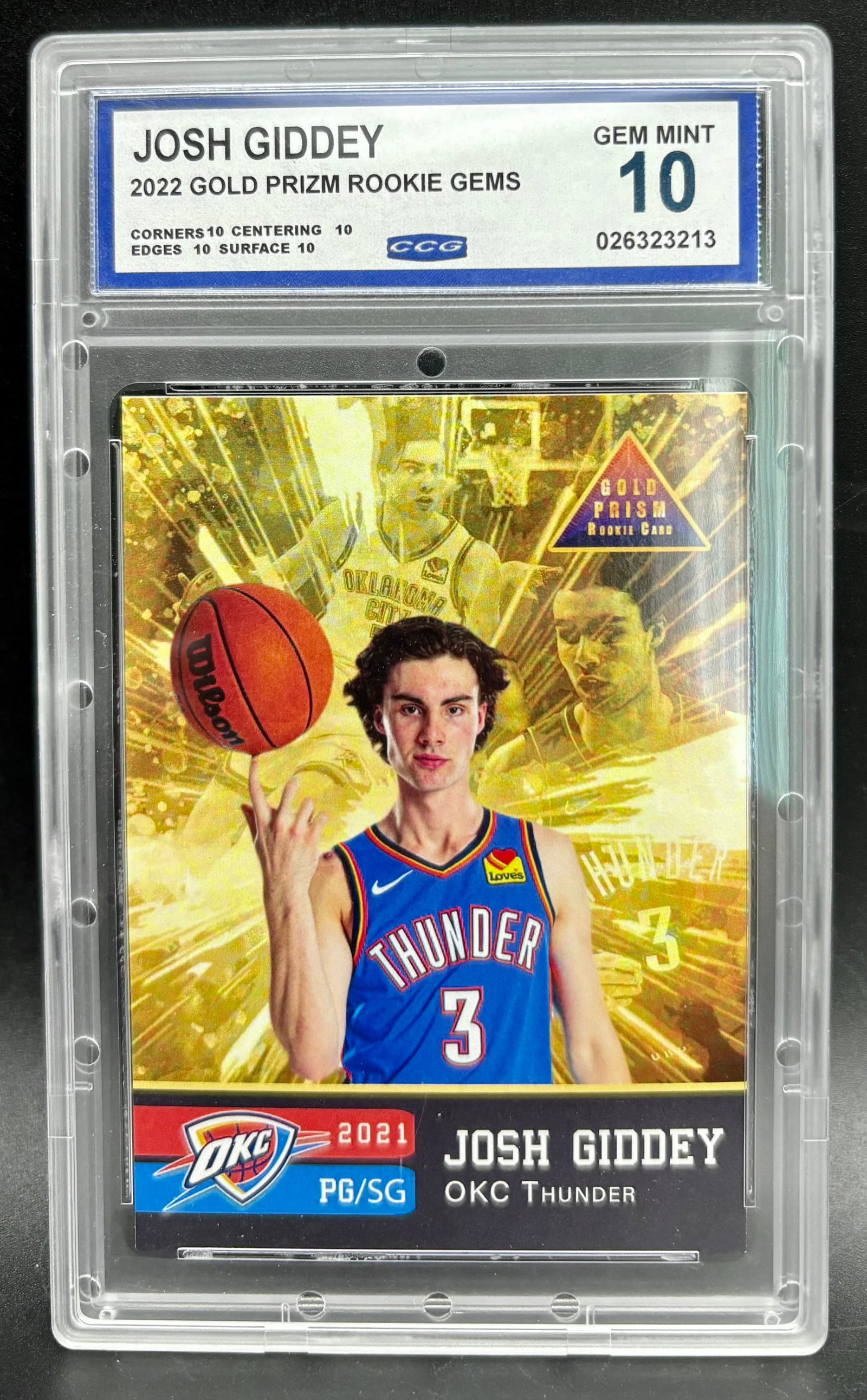 Josh Giddey of the Oklahoma City Thunder: Basketball trading card featuring Josh Giddey of the Oklahoma City Thunder. This 2022 Gold Prizm Rookie Gems edition showcases the young guard with a golden background and multiple action images. The 