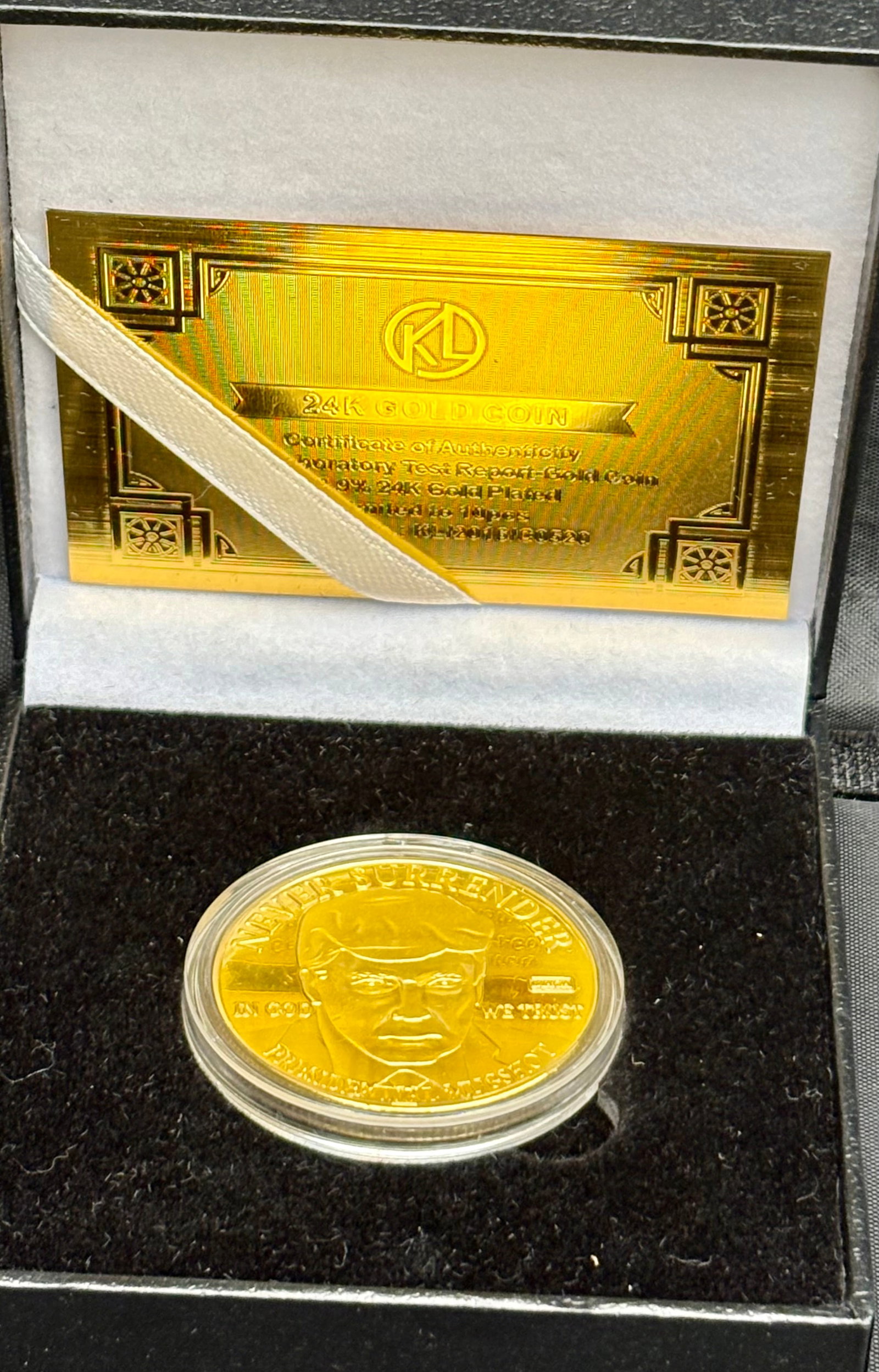 Donald Trump 24k Gold-Plated Commemorative Coin with Box and Certificate: Beautiful Donald Trump commemorative coin plated in 24k gold, featuring the phrase “NEVER SURRENDER” and a portrait of Trump with the date 08-24-2023. The coin comes in a luxurious black velve