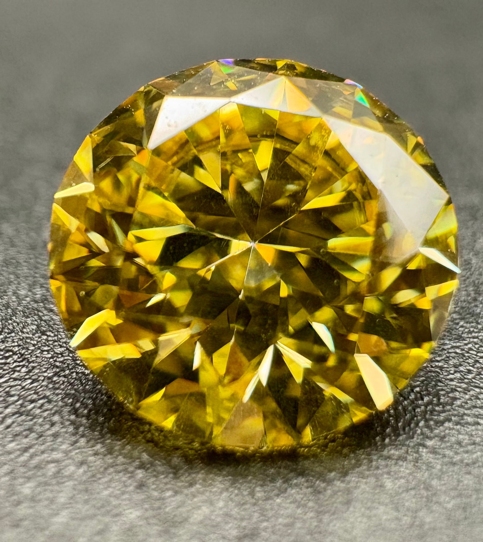 Moissanite stone with brilliant round cut and intense yellow: Loose Moissanite stone with brilliant round cut and intense yellow color. Perfect for creating unique jewelry such as rings, pendants, or earrings. Striking sparkle and flawless finish.