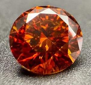 Brilliant round-cut Moissanite in stunning orange-red color