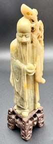 Antique soapstone sculpture depicting a serene traditional Asian