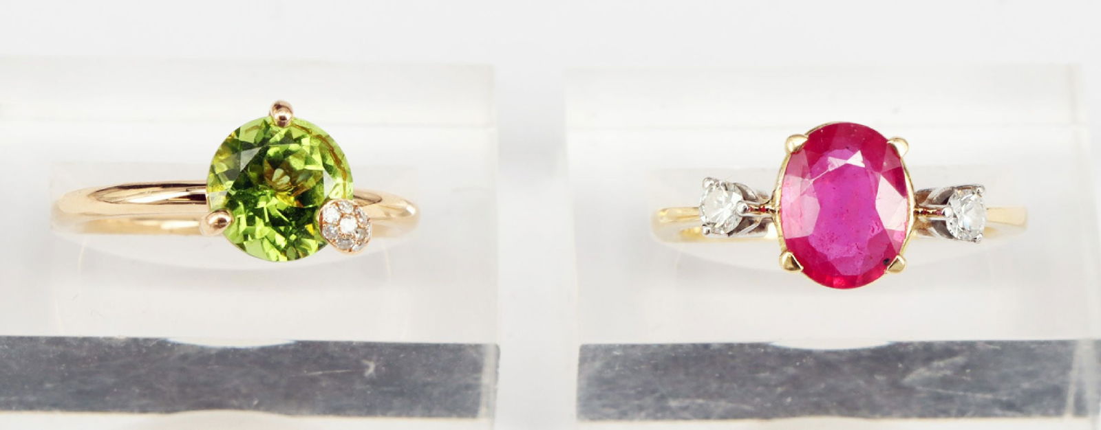 2 rings, signs of wear: Bucherer, ring, 750 GG: 2 rings, signs of wear: Bucherer, ring, 750 GG, 3.3 g. With green stone and diamonds (tested), rail marked, RG53; ring, 750 GG, 3.62 g. With red stone and diamonds (tested), RG562 Ringe, Gebrauchsspur