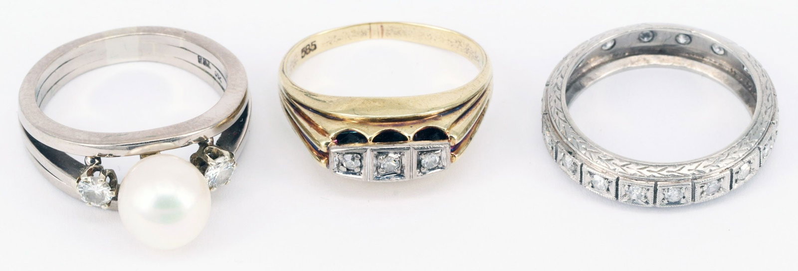 3 rings, all gold, showing signs of wear. - 4