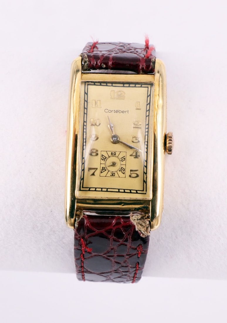 Cortébert, wristwatch, 750 gold case (tested): Cortébert, wristwatch, 750 gold case (tested), rectangular shape, Art Deco style, with applied numerals and small seconds, watch starts running (movement not tested), signs of age and wear, 4 x