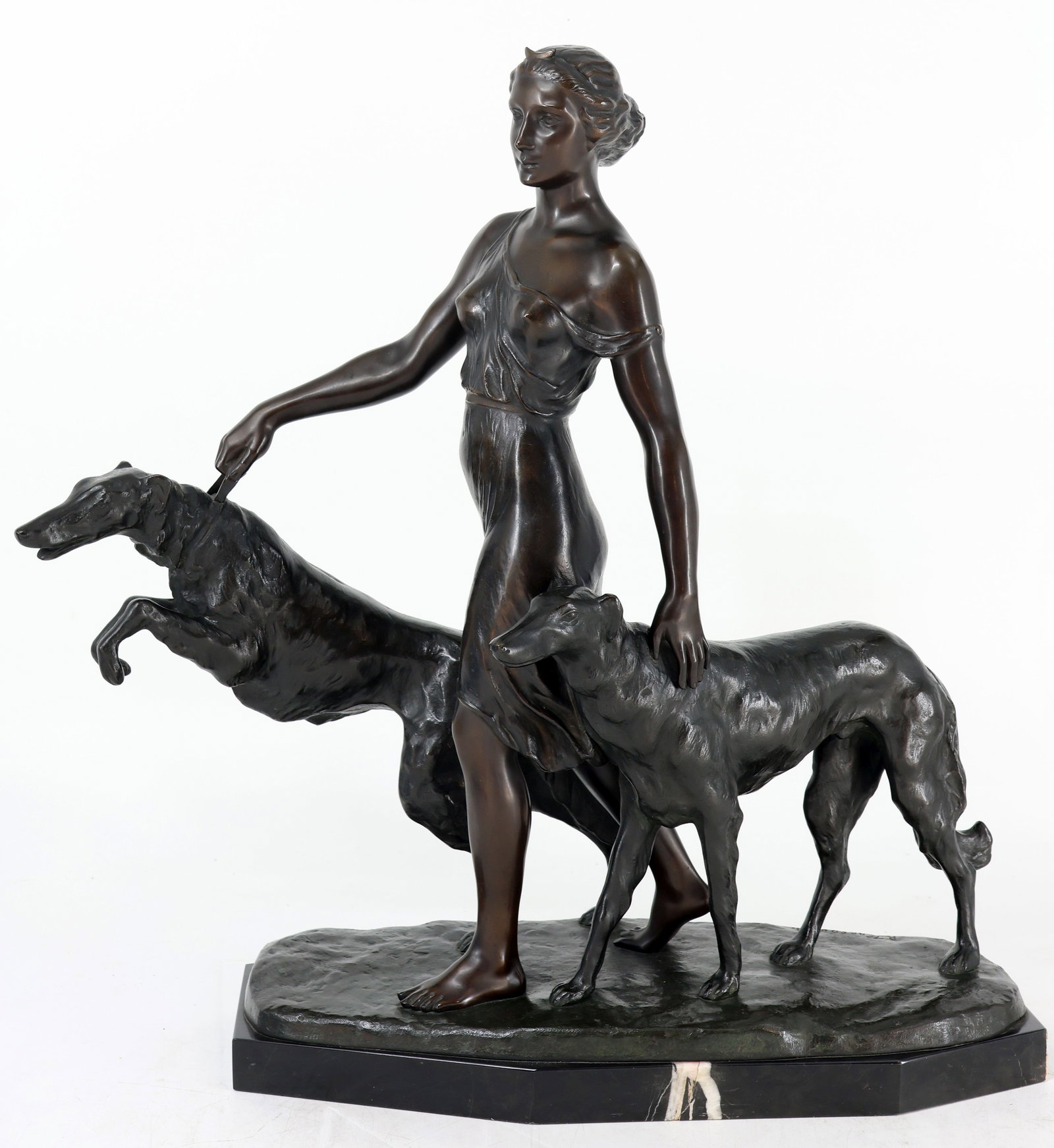 Rudolf KAESBACH (1873–1955), Diana with dogs: Rudolf KAESBACH (1873–1955), Diana, the goddess of the hunt, with two of her greyhounds in dynamic forward motion; beautifully executed; signed; bronze; stone base; signs of age; 58 x 63 x 27