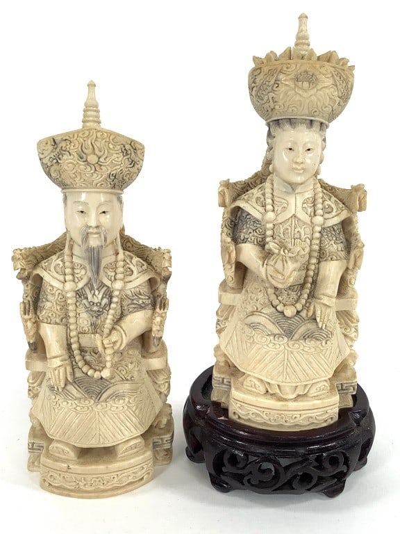 Antique Ivory Chinese Royal Figurines: Two 6 1/4"H statues of an emperor and empress with one 1 1/2"H wood stand. Both have faded blue or black ink on them, both marked on the bottom. These ivory pieces have spectacularly vivid schreger li