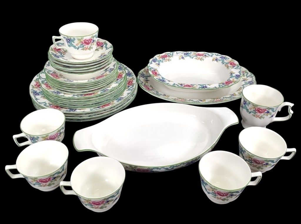 Royal Doulton Floridora Green China Set 31 pcs: Oval serving platter, oval serving bowl, baking dish with handles, 6 tea cups and 5 saucers, 1 coffee mug, 4 dinner (10 3/4"Dia), 6 bread, and 6 salad plates. Some of the dinner plates have surface we