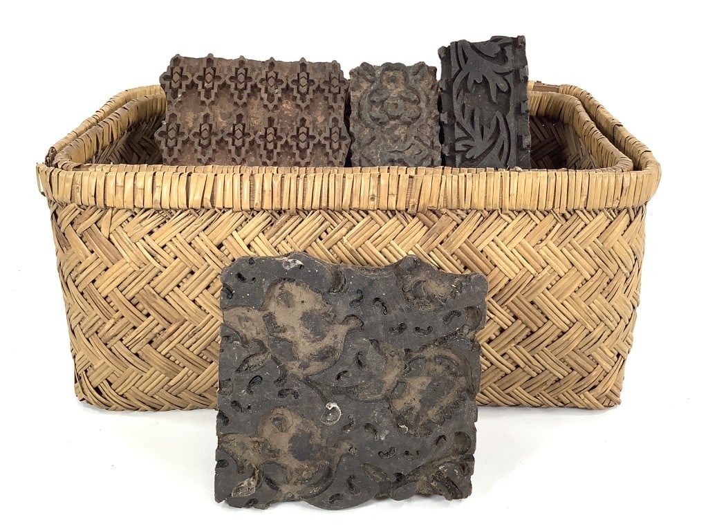 Indian Block Printing Blocks: Seven Indian block printing blocks from 6 1/4"L x 2 3/4"W to 6 1/2"L x 5 1/4"W. The blocks all appear to be handcarved although all are unmarked. Comes with 14 1/2"L x 8 1/2"W x 7 1/2"H woven basket. 