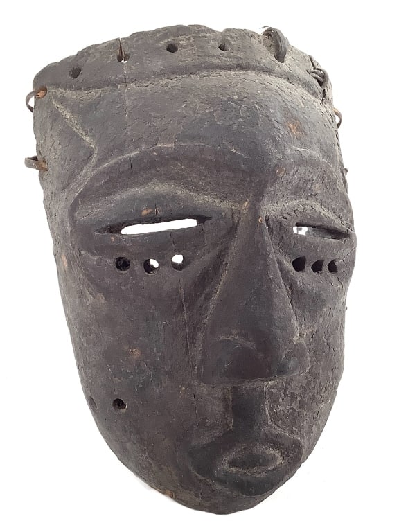 Kuba Wood Mask From The DRC: 11"L x 8"W. Cracked on the left side with woven repairs. Provenance: Collected by Sophia and Roy Sieber.