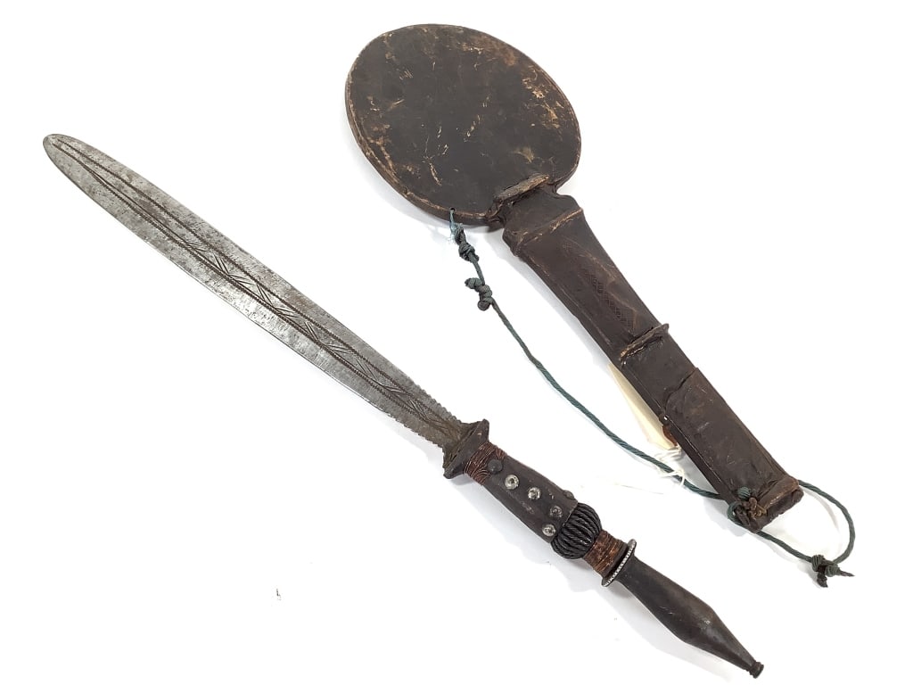DRC Blade With Leather Sheath: 27"L with metal stand. Handle is metal, wood, and copper wire wrapped. Provenance: Collected by Sophia and Roy Sieber.
