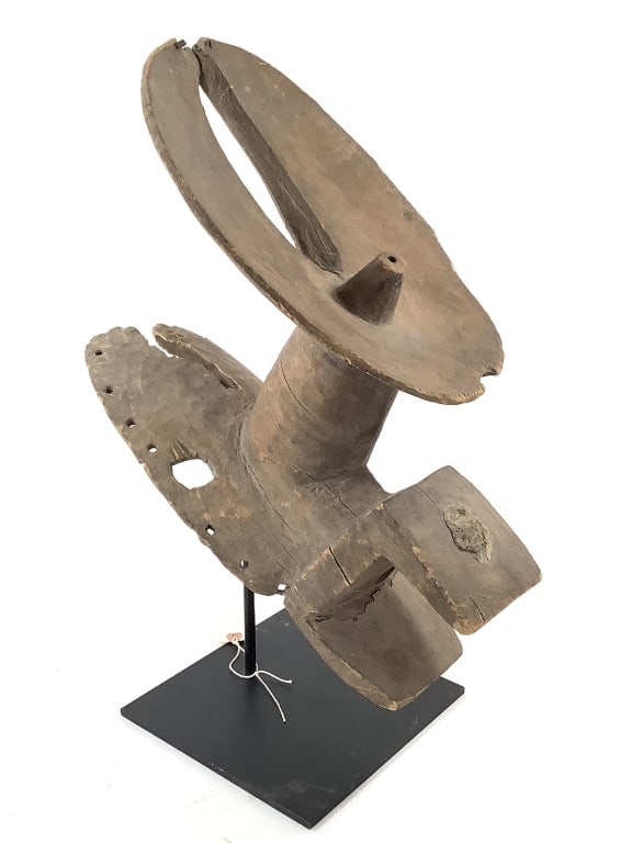 Jukun Crest Mask From Nigeria: 17 1/2"L x 8 1/2"H, comes with metal stand. Cracks and loss present. Provenance: Collected by Sophia and Roy Sieber.