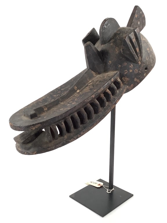 Ijaw Yurhobo Wood Mask From Nigeria: 24"L x 8"W. Comes with metal stand. Provenance: Collected by Sophia and Roy Sieber.