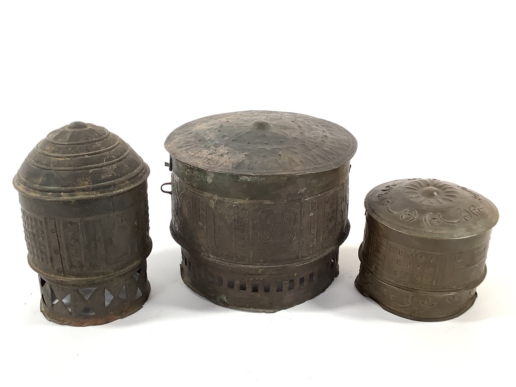 Asante Brass Embossed Containers Ghana: Largest is 8"Dia., 6"H. Smallest is 5"Dia., 7"H. Provenance: Collected by Sophia and Roy Sieber.