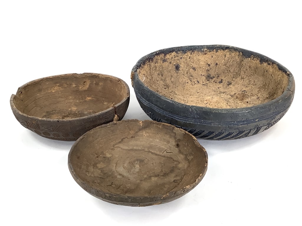 Gourd Carved Bowls: Largest is 17"Dia, visible cracks and loss throughout. Smaller is 12 1/2"Dia, has a lid with metal handles and is in similar condition. Provenance: Collected by Sophia and Roy Sieber.