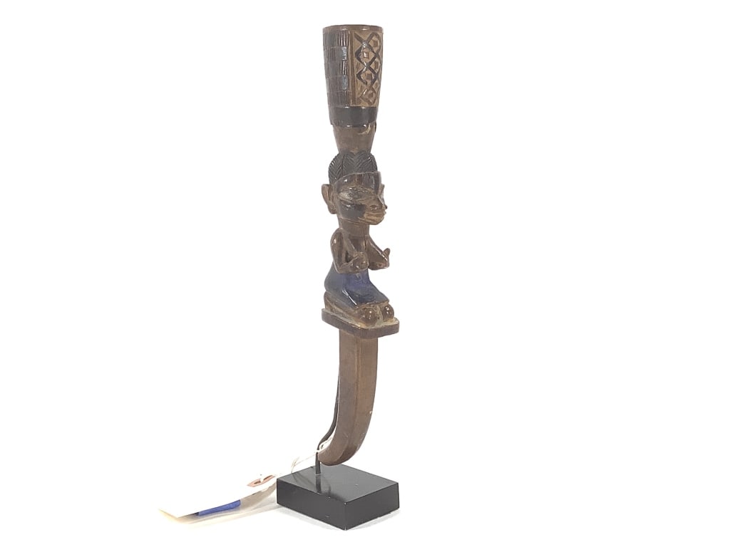 Carved Polychrome Rattle: 11"H with stand, slight loss to back of rattle head. Provenance: Collected by Sophia and Roy Sieber.