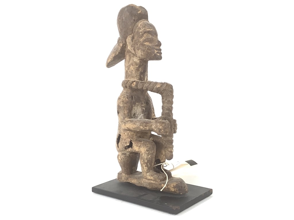 Punu Seated Figure From Gabon: 8"H, comes with stand. Provenance: Collected by Sophia and Roy Sieber.