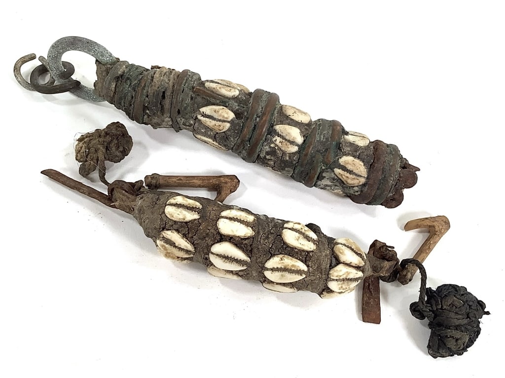 Toma Cowrie Amulet: 6 1/2" and 4 1/2"L. Provenance: Collected by Sophia and Roy Sieber.