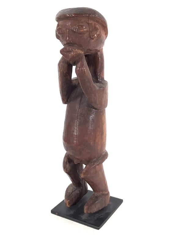 Wood Carved Figure With Hands Clasped Over Mouth: 6 3/4", stand included. Provenance: Collected by Sophia and Roy Sieber.