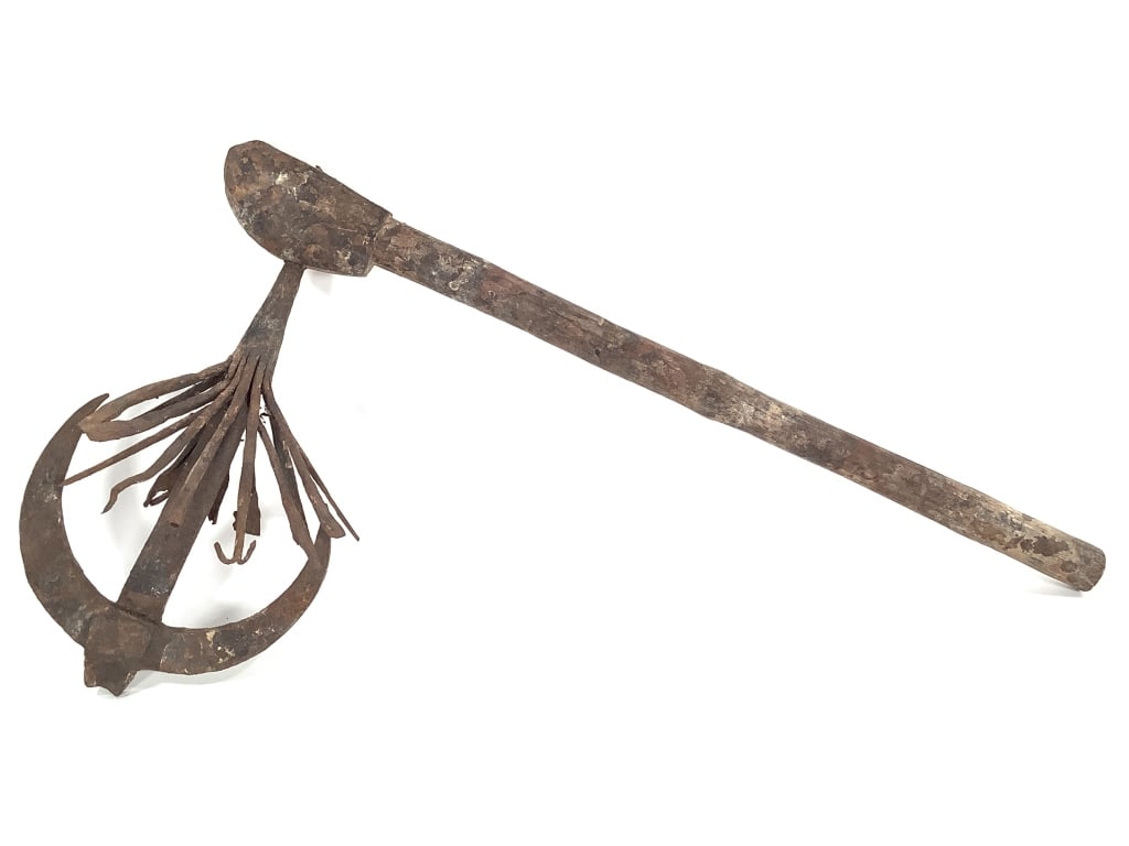 A Fon Recade From Benin: 21"L x 12"W. Ceremonial staff. Metal. Provenance: Collected by Sophia and Roy Sieber.