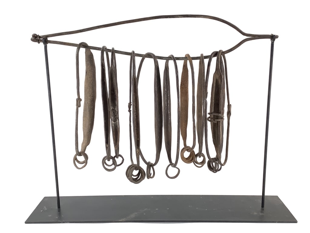 Iron Currency From Cameroon: 22"L with 25"L x 17"H stand. Provenance: Collected by Sophia and Roy Sieber.
