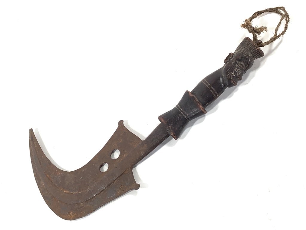 Mangbetu Trumbash Knife With Carved Figural Handle: 13 1/2"L x 8"W. Provenance: Collected by Sophia and Roy Sieber.