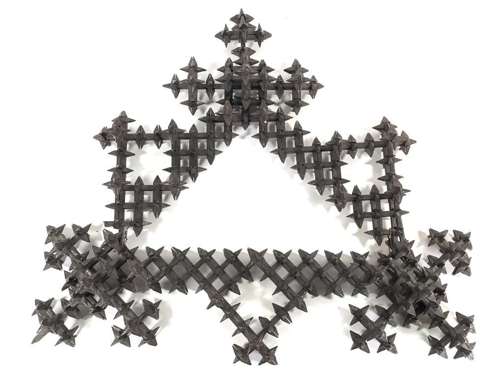 Tramp Art Crown of Thorns Wall Sculpture: 28 1/2"W x 5 1/2"D x 24"H. Rare and unique handcrafted, notch-carved and painted wood black over green. Late 19th-Early 20th C. Some pieces wired in, minor losses, loose pieces detached. Provenance: