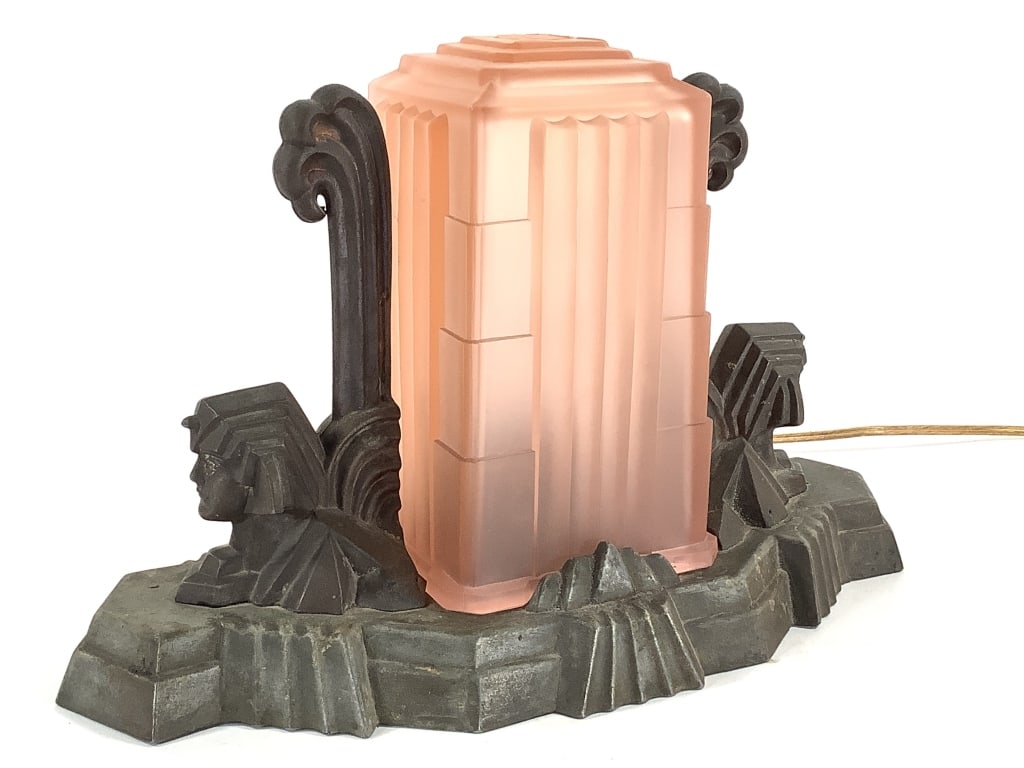 Art Deco Egyptian Revival Sphinx Boudoir Lamp: 13"L x 5"W x 8"H overall. Removable pink glass shade with just one small nick on the base. Finger turn switch at back, rewiring recommended. Provenance: Collection of William and Diane Itter.