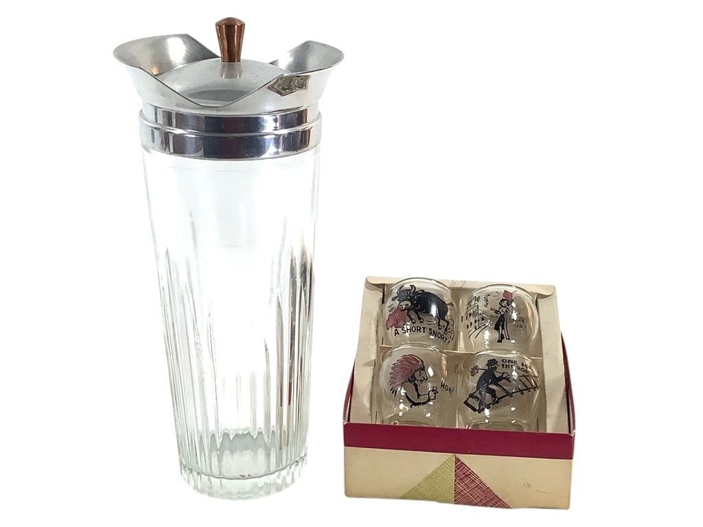 The Itter Martini Pitcher & Painted Shot Glasses: Pressed glass with chrome strainer and cover, copperized knob. 10 1/2""H. Shot glasses with 'humorous' painted slogans and images. Provenance: Collection of William and Diane Itter.