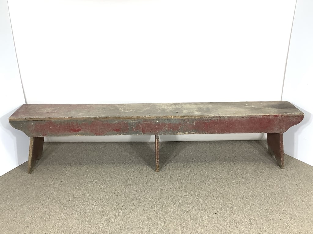 Primitive Bench w Old Paint: 79 1/2" x 11 1/2" x 18"H. Old boot / trestle bench with great patina, worn original red paint. Scroll cut leg braces. Provenance: Collection of William and Diane Itter.
