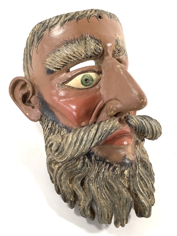 Barbon Bearded Man Dance Mask 1900-1960: Guatemalan or Mexican origin. 14"H. Larger than life, hand carved wood mask with painted details, green eyes. Great patina and some surface paint loss. Provenance: Collection of William and Diane Itte