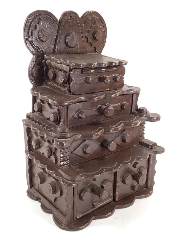 Folk Art Stacked Drawer Dresser / Desk Box: 12"W x 8 1/4"D x 17 1/2"H. Stacked drawers with applied knobs and cut panel decoration. Brown paint overall. Provenance: Collection of William and Diane Itter.