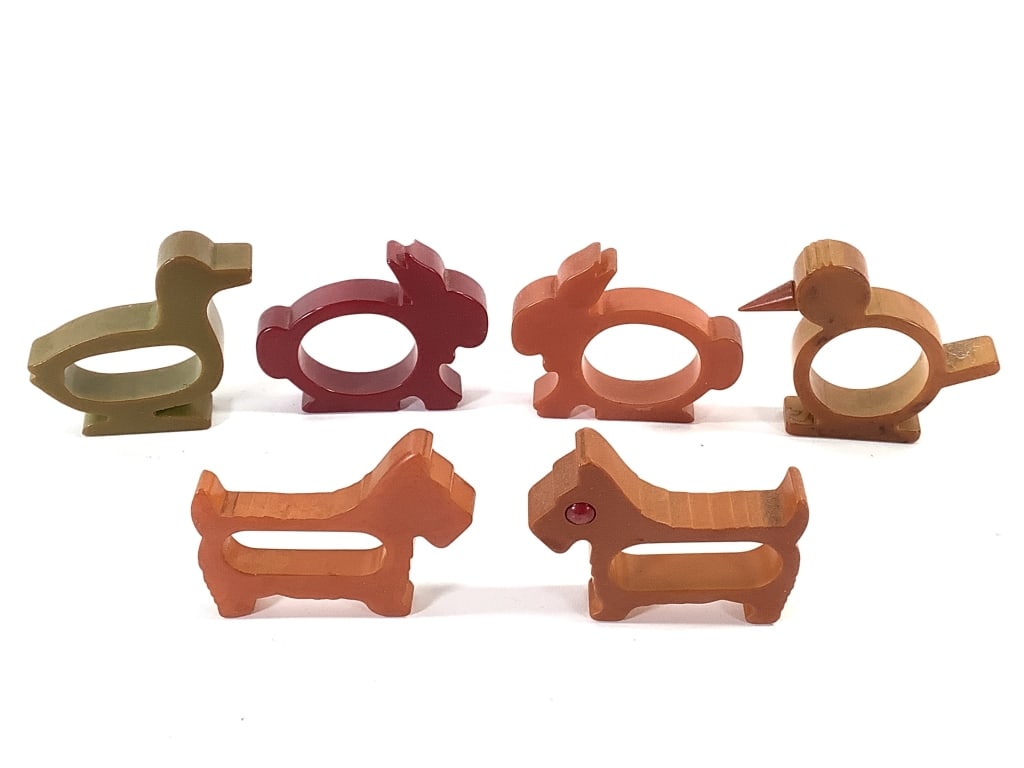 6 Bakelite Animal Shape Napkin Rings: 2 rabbits, 2 styles of Scottie dogs, duck and bird. 2 3/4" - 3"L. Provenance: Collection of William and Diane Itter.