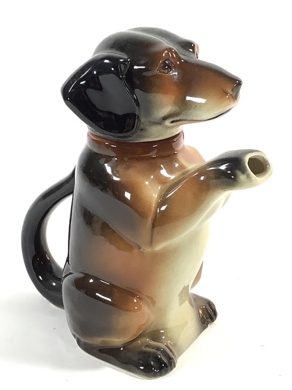 Erphila German Dachshund Dog Teapot #0703B: 8 1/4"H. Crazing, glaze nicks at base. Stamp mark on bottom with in mold incised model number. Provenance: Collection of William and Diane Itter.