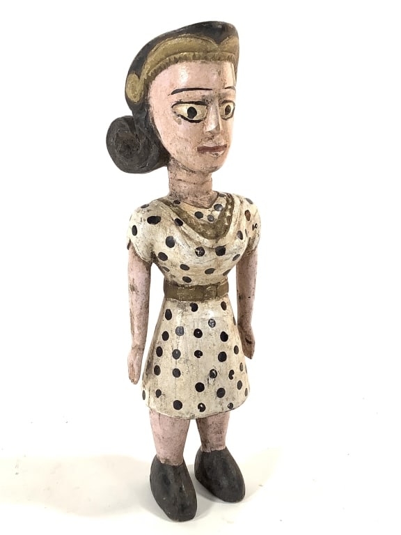 Carved & Polychrome Wood Lady Folk Art: 9 3/4"H. Female figure wearing a polka dot dress with flip up hair. Unsigned, unknown country of origin. Provenance: Collection of William and Diane Itter.