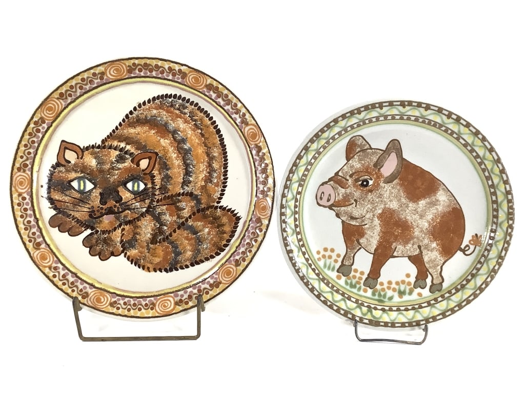 Rothwoman Pig & Cat Pottery Plates: Rothwoman, Janet (American 1920-2008). 11 3/4" plate with cat, 10 3/8" plate with pig. Signed Rothwoman on back. Very good condition, surface scratches. Provenance: Collection of William and Diane Itt