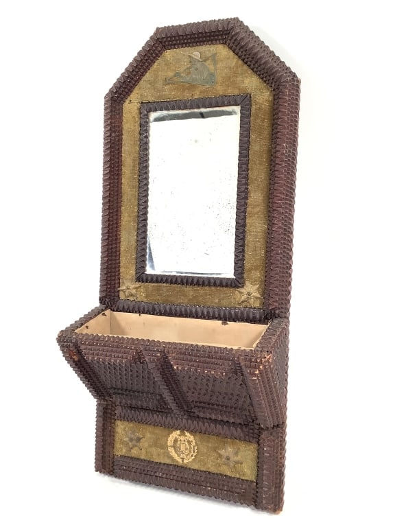 Tramp Art Wall Mount Comb Box & Mirror: 20 1/4"H, 9"W x 4"D. Unusual and finely carved V pattern face layers, inset mirror, velvet upholstered back with added metal mounts. Pocket is fabric lined. Note crate box back board with staples and 