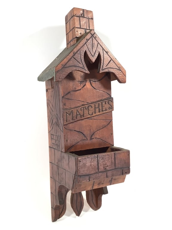 Folk Art Carved Wood House Form Match Holder: 5"W x 4 1/2"D x 14 1/2"H. Wall mount match holder. Front hinges to load without removing from the wall. Provenance: Collection of William and Diane Itter.