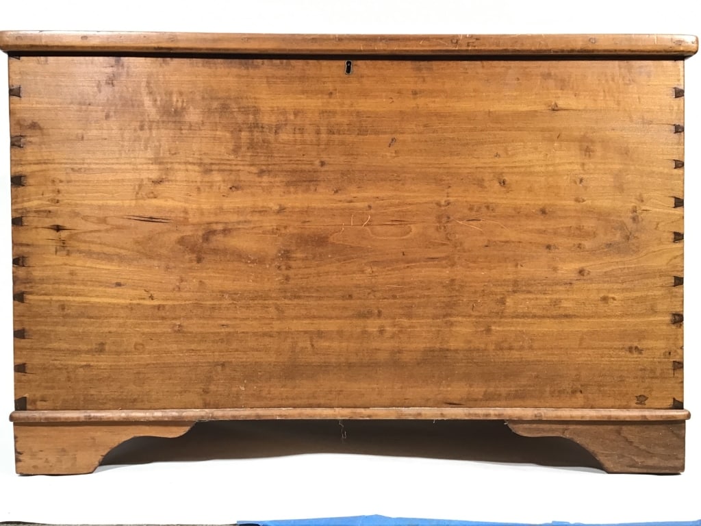 Antique American Single Plank Dovetail Chest: 37 1/2" x 21 3/4"D x 24"H. Blanket chest with sides and top constructed of single chestnut planks. Bracket front feet, hinged top with framed edge. Fiber board panel placed in bottom. Provenance: Coll