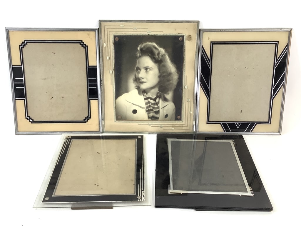 5 Art Deco Glass Picture Frames w Black & Silver: 4 - 12" x 10" (2 without edge frames, 2 have broken easel supports). 13" x 11" without edge frame, decorative boarders and photo. Provenance: Collection of William and Diane Itter.