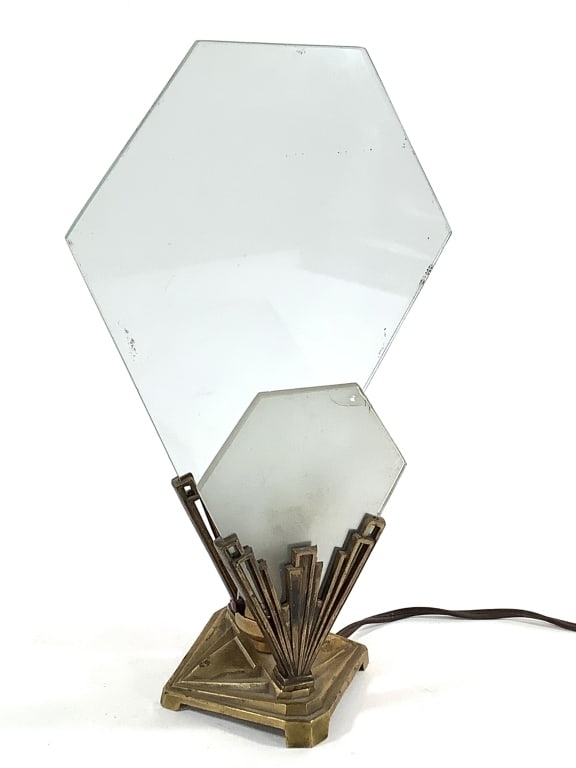 Art Deco Brass Lamp w Glass Panel Shades: Unusual geometric modernist cast brass base with supports for 2 removable glass shades. Overall 12 1/2"H. Clear glass back panel, frosted glass front panel (chip on clear side). Provenance: Collection